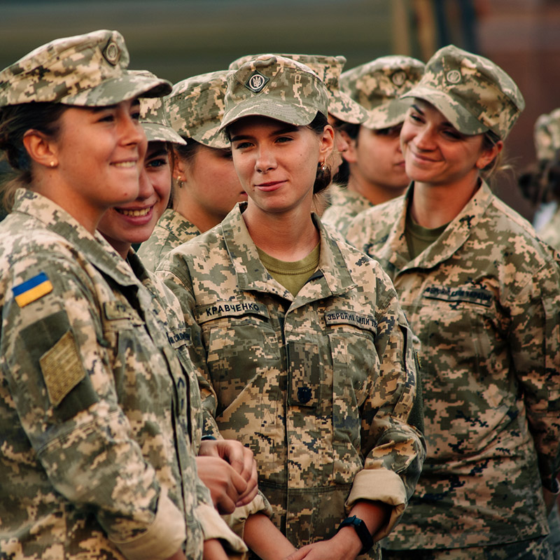Kyiv, Ukraine - August 20, 2021: Rehearsal of the military parade on occasion of 30 years Independence Day of Ukraine. Young smiling women in military camouflage uniform on Khreshchatyk street